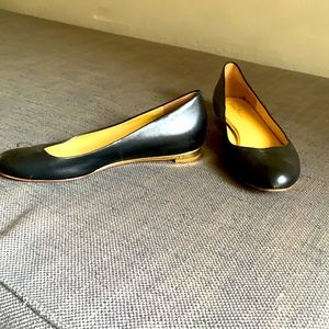 Cole Haan black ballet flats with gold trim at heel, size 10